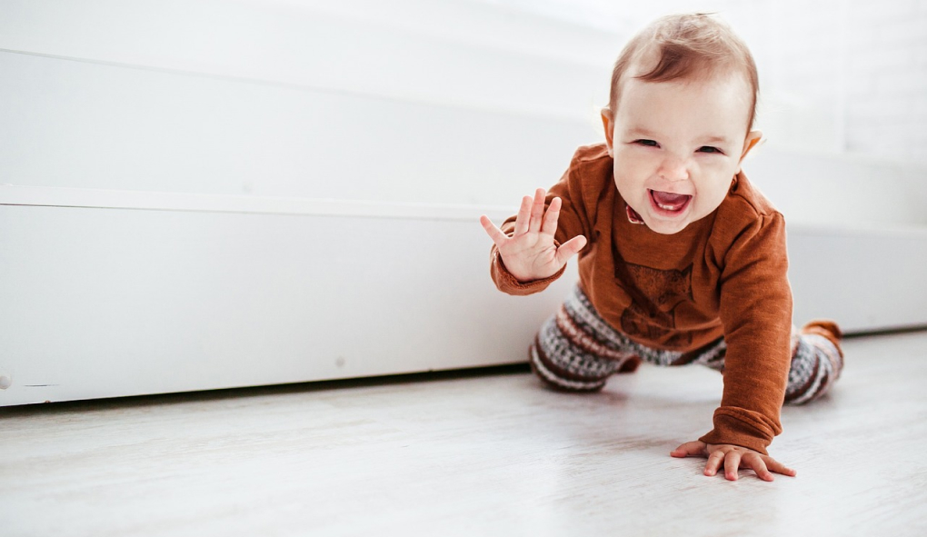 baby crawling on heated floor